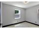 Bedroom featuring neutral paint, fan, and natural light at 8603 N 9Th St, Tampa, FL 33604