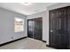 Bedroom featuring neutral paint, large closet, and natural light at 8603 N 9Th St, Tampa, FL 33604