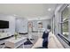Stylishly staged living area boasting modern decor, comfortable seating, and a dining area bathed in natural light at 8603 N 9Th St, Tampa, FL 33604