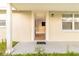 Inviting covered front porch leads to the front door with an open view of the home's interior at 9020 Gray Fox Ln, Port Richey, FL 34668