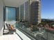 Balcony view of the city featuring seating area and palm tree landscaping at 100 1St N Ave # 702, St Petersburg, FL 33701