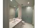 Bright bathroom with vanity and glass-enclosed shower at 100 1St N Ave # 702, St Petersburg, FL 33701