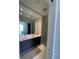 Bright bathroom with double vanity, large mirror, and glass-enclosed shower at 100 1St N Ave # 702, St Petersburg, FL 33701