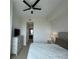 Bright bedroom with TV and view of an ensuite bathroom at 100 1St N Ave # 702, St Petersburg, FL 33701