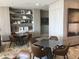 Inviting common area featuring modern tables, chairs, and stylish decor on built-in shelving at 100 1St N Ave # 702, St Petersburg, FL 33701
