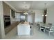 Modern kitchen featuring stainless steel appliances, a kitchen island and a dining area at 100 1St N Ave # 702, St Petersburg, FL 33701