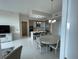 Bright, open-concept kitchen with island, stainless steel appliances, and dining area with modern chandelier at 100 1St N Ave # 702, St Petersburg, FL 33701