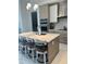 Modern kitchen with an island, white countertops, and seating for four at 100 1St N Ave # 702, St Petersburg, FL 33701