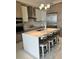 Modern kitchen with an island, white countertops, and seating for four at 100 1St N Ave # 702, St Petersburg, FL 33701