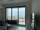 Bright living room featuring a wide sliding glass door with panoramic marina views and modern decor at 100 1St N Ave # 702, St Petersburg, FL 33701