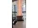 Bright lobby area featuring modern lighting fixture, floor to ceiling windows, and comfortable seating at 100 1St N Ave # 702, St Petersburg, FL 33701
