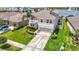 Well-maintained property with lush greenery and a spacious two-car garage overlooking a pond at 1022 Montgomery Bell Rd, Wesley Chapel, FL 33543