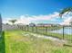 Well-maintained lawn backs onto a tranquil lake; wrought iron fence defines the property at 1022 Montgomery Bell Rd, Wesley Chapel, FL 33543