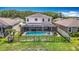 Spacious backyard features an enclosed pool area, well-maintained lawn, and great privacy at 1022 Montgomery Bell Rd, Wesley Chapel, FL 33543