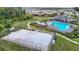 Overhead shot of the community basketball court, set between pool and homes at 1022 Montgomery Bell Rd, Wesley Chapel, FL 33543
