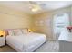 Comfortable bedroom featuring a light fixture and view to the neighborhood at 1022 Montgomery Bell Rd, Wesley Chapel, FL 33543