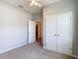 Bedroom with standard closet and a view to the hallway at 1022 Montgomery Bell Rd, Wesley Chapel, FL 33543