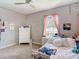 Neutral bedroom features carpet, white furnishings, plenty of decor and view of the outdoors at 1022 Montgomery Bell Rd, Wesley Chapel, FL 33543