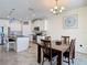 Open floor plan featuring a kitchen with breakfast bar open to dining area at 1022 Montgomery Bell Rd, Wesley Chapel, FL 33543