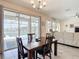 Open-concept dining room offers views of the pool, patio, and lake at 1022 Montgomery Bell Rd, Wesley Chapel, FL 33543