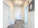 Bright foyer features tile flooring, a bench with storage, and a stylish mirror to welcome guests at 1022 Montgomery Bell Rd, Wesley Chapel, FL 33543