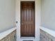 Inviting front door with a digital lock system, adding a touch of security at 1022 Montgomery Bell Rd, Wesley Chapel, FL 33543