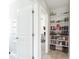 Bright hallway with built-in shelving unit, perfect for displaying books and decorative items at 1022 Montgomery Bell Rd, Wesley Chapel, FL 33543