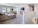 Upstairs living room features neutral decor, large windows, and plenty of space for relaxing and entertaining at 1022 Montgomery Bell Rd, Wesley Chapel, FL 33543