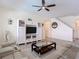 Cozy living room features a large entertainment center and comfortable seating at 1022 Montgomery Bell Rd, Wesley Chapel, FL 33543