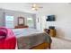 Large main bedroom featuring carpet, neutral walls and views of the outdoors through multiple windows at 1022 Montgomery Bell Rd, Wesley Chapel, FL 33543