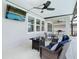 Comfortable screened patio with ceiling fans, tv, plenty of room for seating and entertaining at 1022 Montgomery Bell Rd, Wesley Chapel, FL 33543