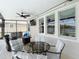 Comfortable screened patio with ceiling fan, tv, plenty of seating with view of the lake at 1022 Montgomery Bell Rd, Wesley Chapel, FL 33543