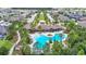 Aerial shot of a resort-style pool in a residential community with lush trees and neighborhood views at 1022 Montgomery Bell Rd, Wesley Chapel, FL 33543