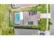 Aerial view of home highlighting screened-in pool and solar panels at 1022 Montgomery Bell Rd, Wesley Chapel, FL 33543