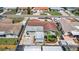 Aerial view of the house showcasing the roof, backyard, and surrounding landscaping at 10400 112Th Way, Largo, FL 33778