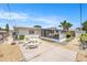 Private backyard featuring a concrete patio with picnic table and a screened-in porch at 10400 112Th Way, Largo, FL 33778