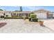 Charming single-story home featuring a brick facade, white trim, and a well-maintained landscaped yard at 10400 112Th Way, Largo, FL 33778