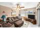 Cozy living room with comfortable seating, ceiling fan, and natural light at 10400 112Th Way, Largo, FL 33778