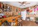 Eclectic living room area with wood-paneled walls, bar, and decorated shelves at 10400 112Th Way, Largo, FL 33778