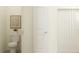Well-lit bathroom with a toilet and a shower with stylish shower curtain at 10812 Keato Beach Ct, Tampa, FL 33647