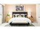 Serene primary bedroom with elegant decor, luxurious linens, and soothing ambiance at 10812 Keato Beach Ct, Tampa, FL 33647
