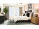 Spacious main bedroom features stylish decor, comfortable linens, and natural light at 10812 Keato Beach Ct, Tampa, FL 33647