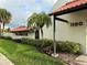 Exterior of a well-maintained building with the Willowbrook sign, a palm tree, and manicured landscaping at 1100 E Bay Dr # 96, Largo, FL 33770