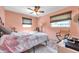 Inviting bedroom with a cozy bed, soft lighting, and soothing colors for a peaceful retreat at 11348 59Th Ter, Seminole, FL 33772