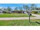 Charming single-story home featuring a well-kept lawn, inviting curb appeal, and a convenient attached garage at 11348 59Th Ter, Seminole, FL 33772