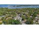 Aerial view showcases a house with mature trees and serene water views in a beautiful neighborhood at 116 24Th S Ave, St Petersburg, FL 33705