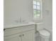 Bright bathroom features white cabinets, modern fixtures and tile floor at 116 24Th S Ave, St Petersburg, FL 33705