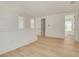 Bright hallway features hardwood floors and three doorways at 116 24Th S Ave, St Petersburg, FL 33705