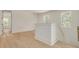Bright hallway features hardwood floors and two windows with natural light at 116 24Th S Ave, St Petersburg, FL 33705