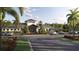 Beautiful clubhouse featuring lush landscaping and ample parking at 11757 E 74Th Cir, Palmetto, FL 34221